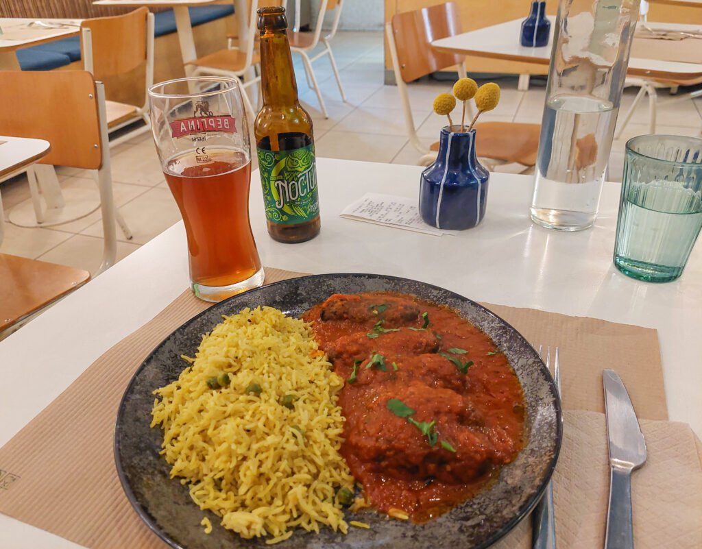 Baked eggplant soutzoukaki with homemade tomato sauce and rice from Mama Tierra in Athens Greece
