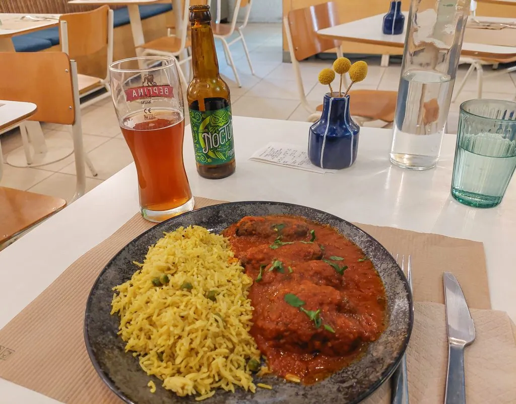 Baked eggplant soutzoukaki with homemade tomato sauce and rice from Mama Tierra in Athens Greece